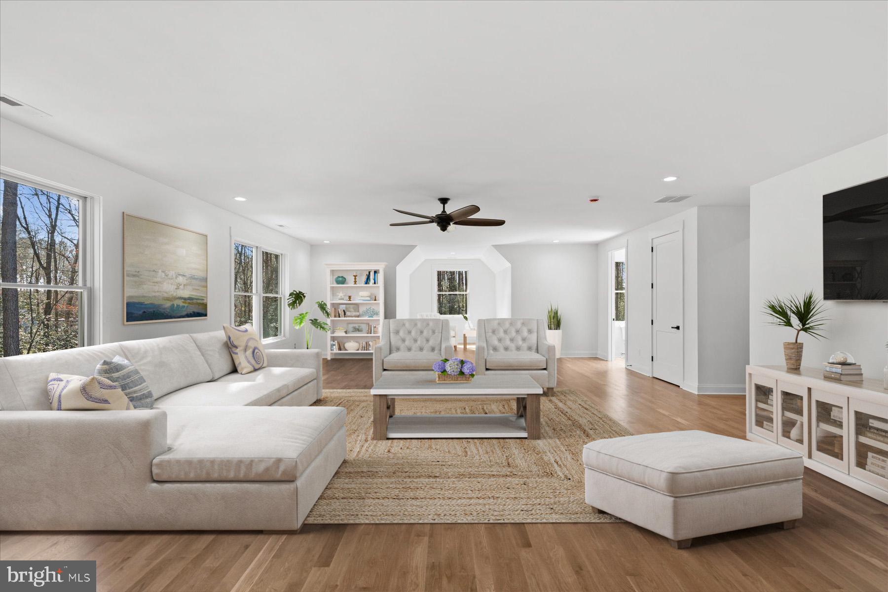 30425 Hollymount Road Harbeson, DE 19951 - Photo 71 of 98 a living room with furniture and a flat screen tv