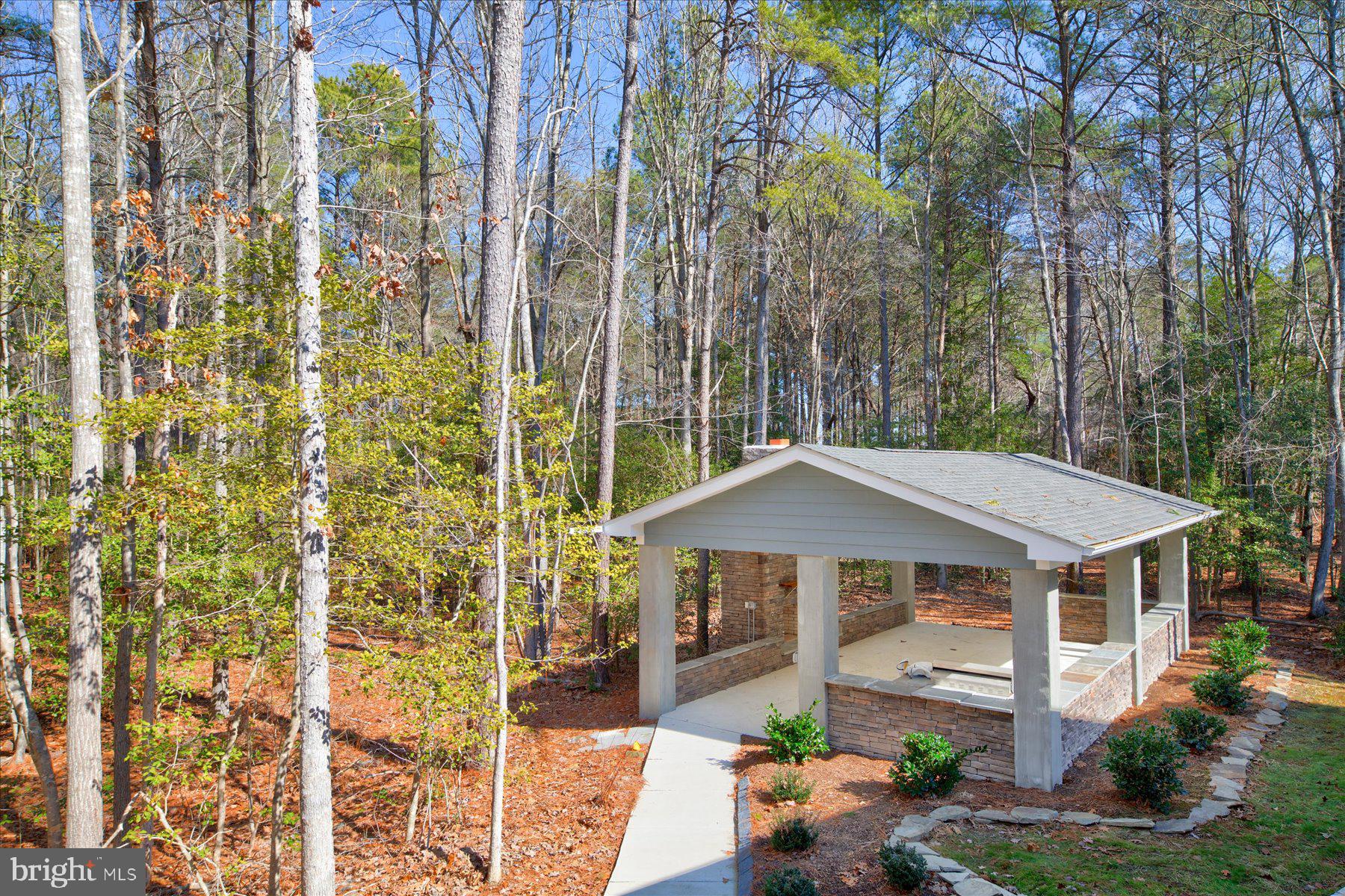 30425 Hollymount Road Harbeson, DE 19951 - Photo 88 of 98 a front view of a house with yard and patio