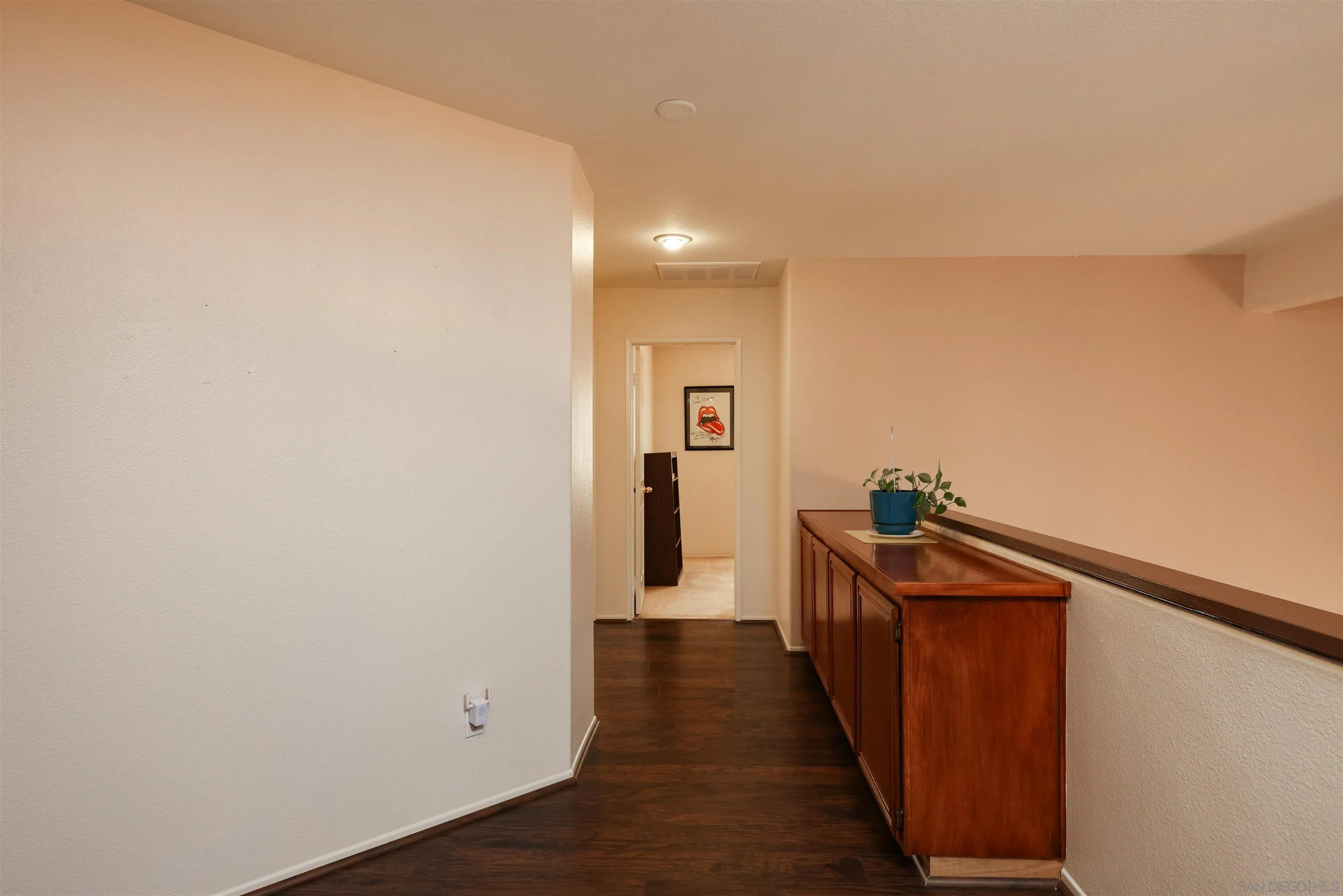 2 Bella Minozza Lake Elsinore, CA 92532 - Photo 14 of 30 a view of a hallway with wooden floor