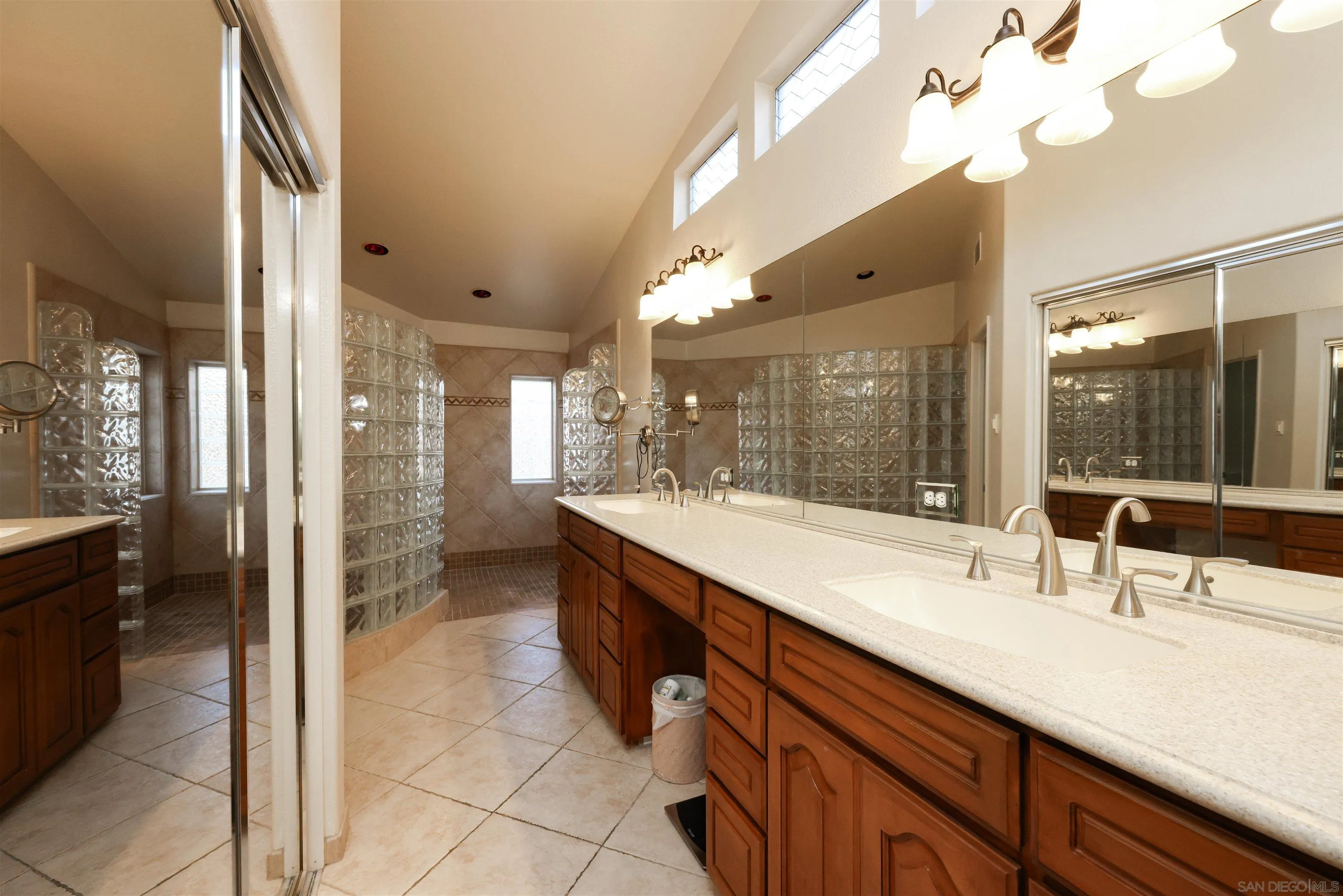 2 Bella Minozza Lake Elsinore, CA 92532 - Photo 21 of 30 a large bathroom with a double vanity sink a mirror and a shower