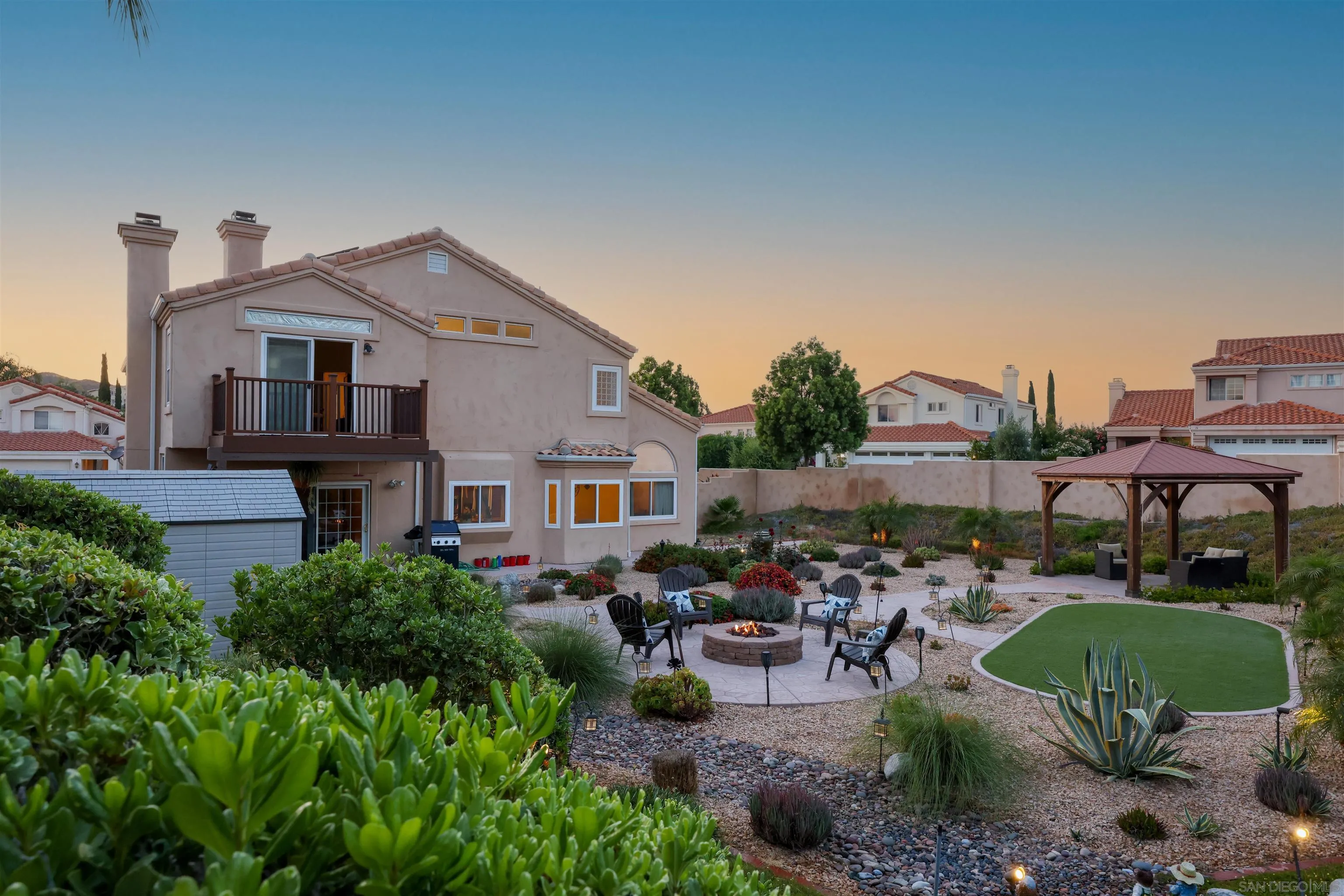 2 Bella Minozza Lake Elsinore, CA 92532 - Photo 27 of 30 a view of a patio with table and chairs under an umbrella