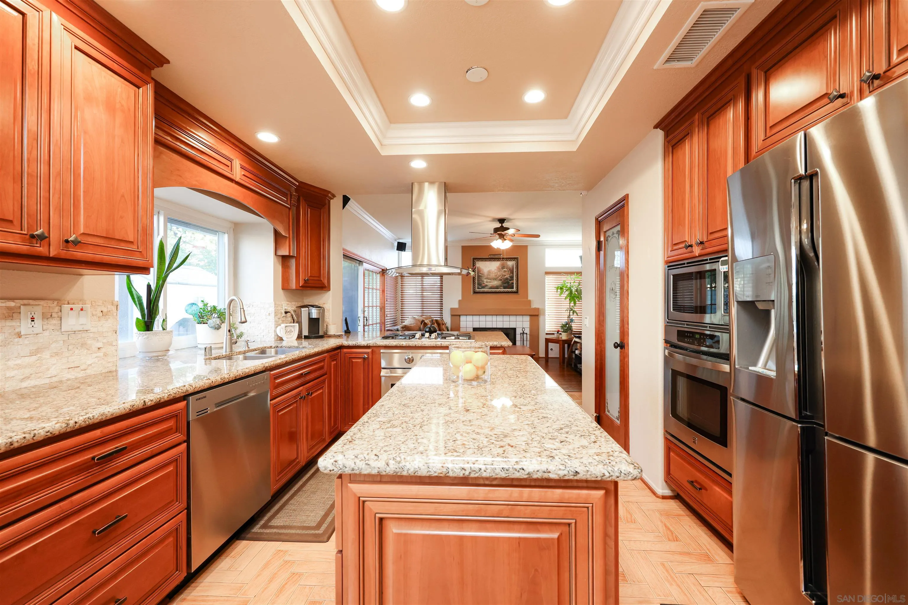 2 Bella Minozza Lake Elsinore, CA 92532 - Photo 7 of 30 a large kitchen with granite countertop a large counter top appliances and cabinets