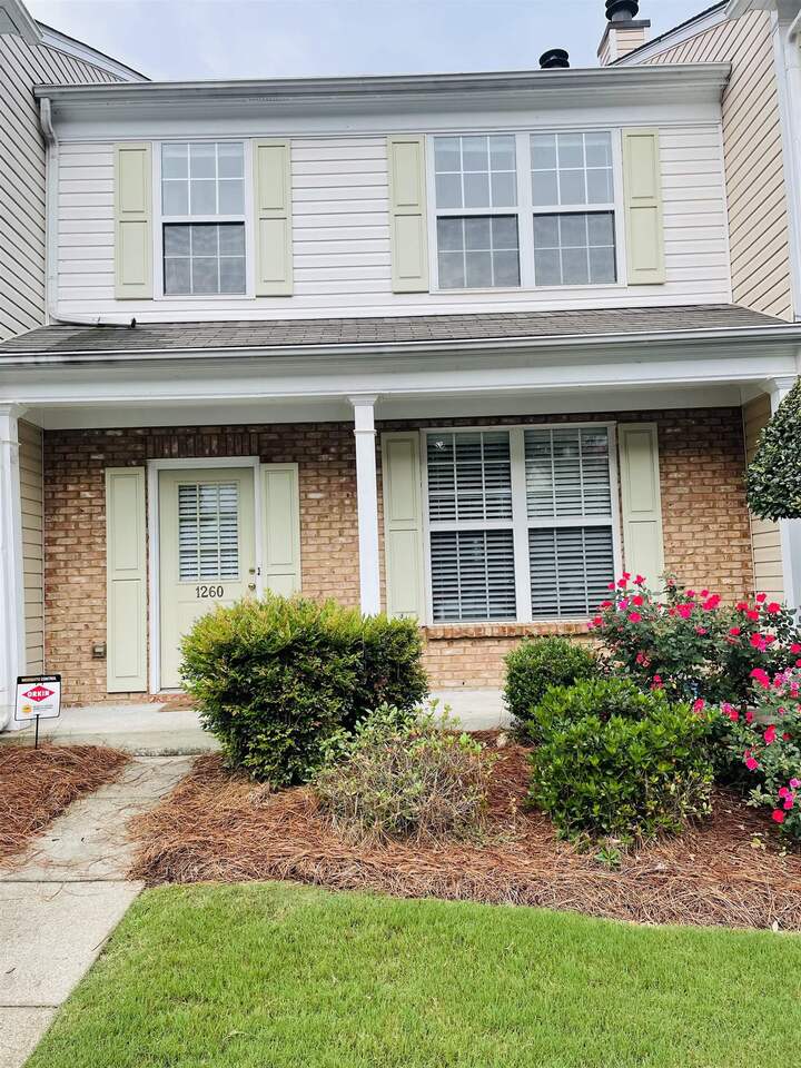 1260 Whitestone Ridge Alpharetta, GA 30005 - Photo 1 of 1 a front view of a house with garden
