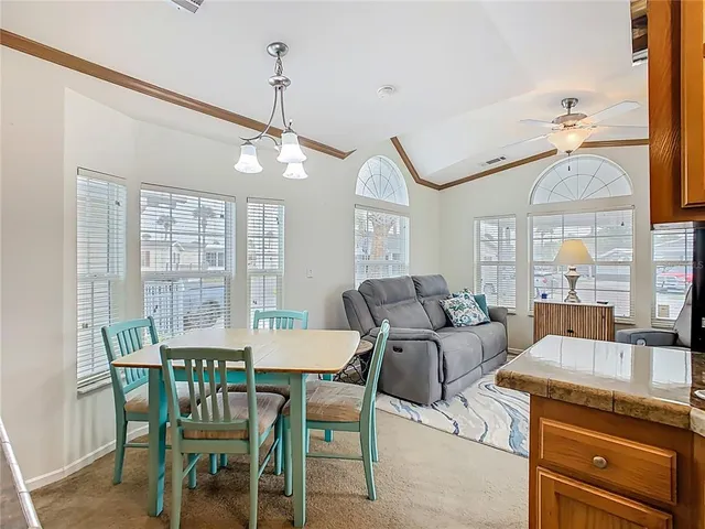 a view of a dining room with furniture window and outside view
