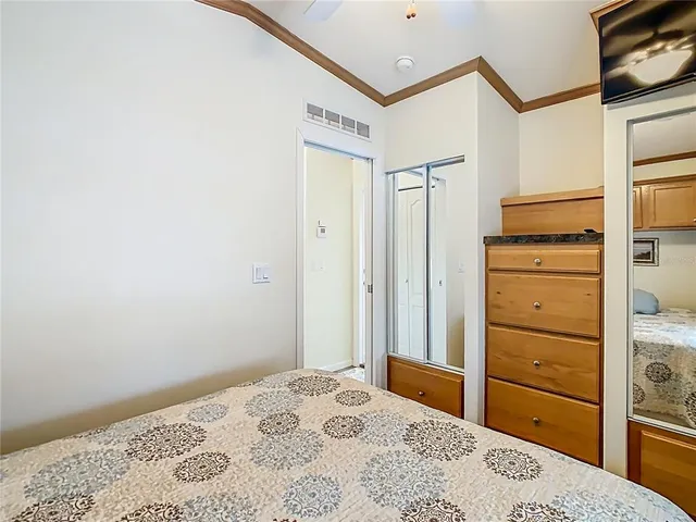 a bedroom with a bed and a dresser