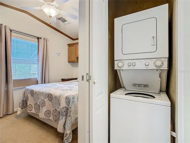 a bedroom with a bed and a mirror