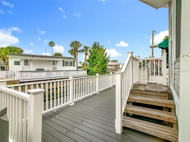 a view of a house with wooden fence