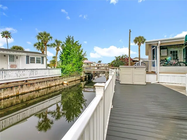 a view of a house with wooden deck