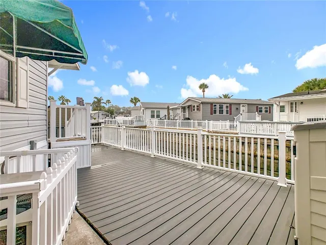 a view of a balcony with wooden floor