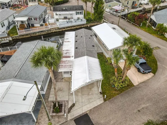 an aerial view of a house with a garden and plants