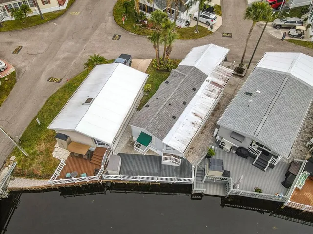 an aerial view of a residential houses with outdoor space