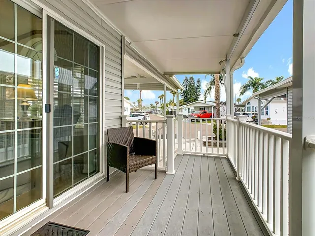 a view of a chairs and table in a balcony