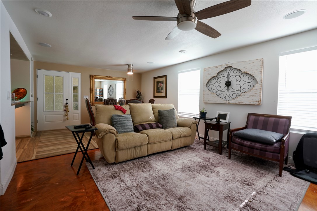 7296 Ligurta Road Golden Valley, AZ 86413 - Photo 10 of 49 a living room with furniture a rug and a window