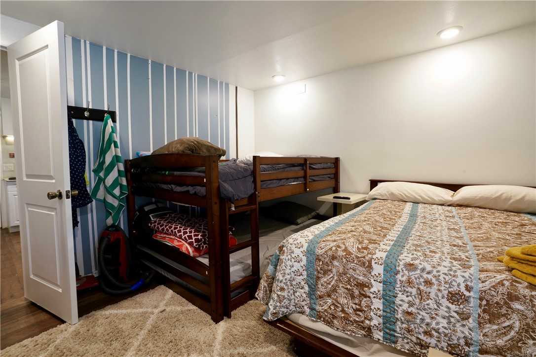 7296 Ligurta Road Golden Valley, AZ 86413 - Photo 22 of 49 a bedroom with a bed and a mirror