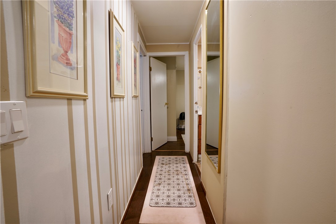 7296 Ligurta Road Golden Valley, AZ 86413 - Photo 23 of 49 a view of a hallway with wooden floor and staircase