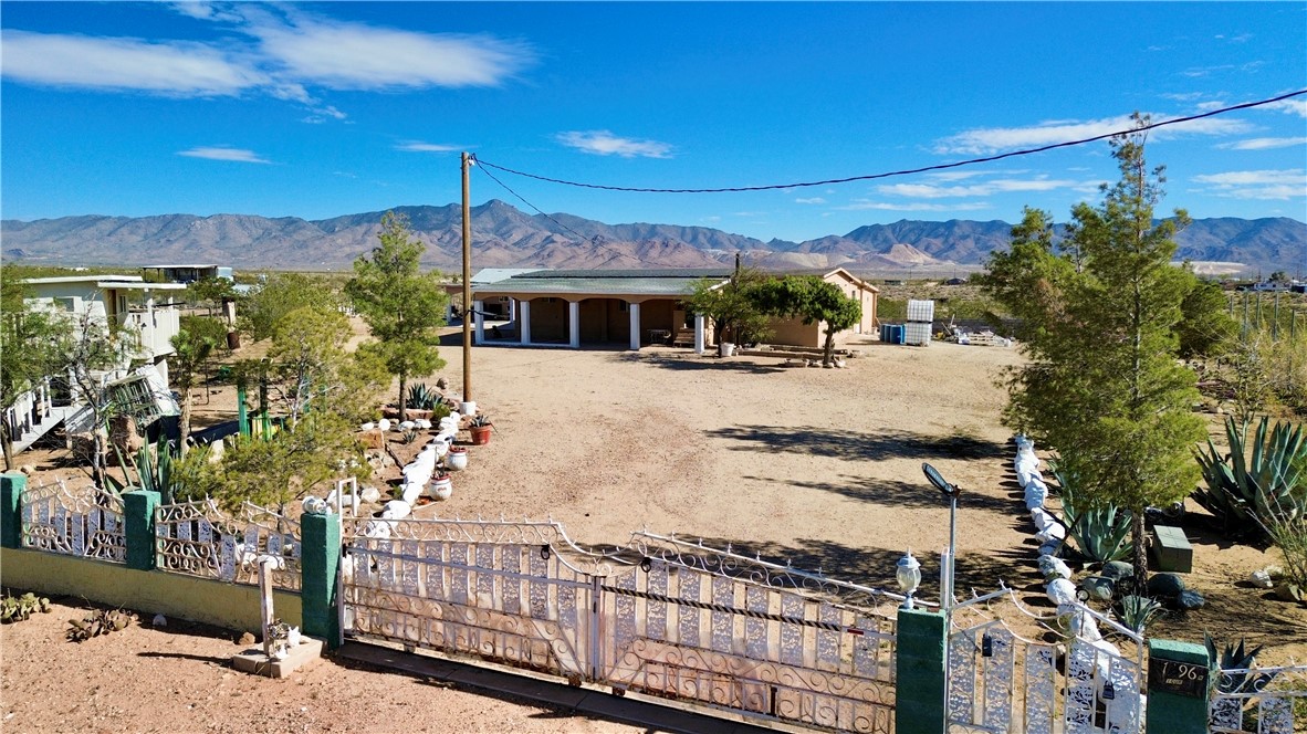 7296 Ligurta Road Golden Valley, AZ 86413 - Photo 3 of 49 a view of a house with wooden fence