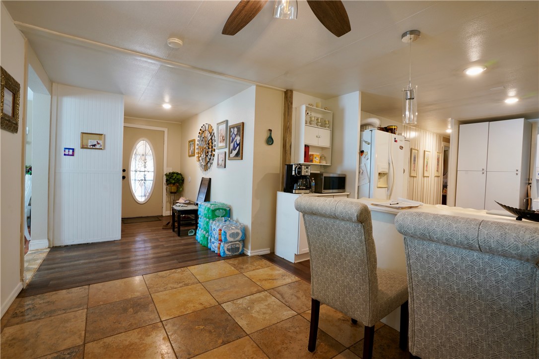 7296 Ligurta Road Golden Valley, AZ 86413 - Photo 34 of 49 a living room with furniture and a chandelier