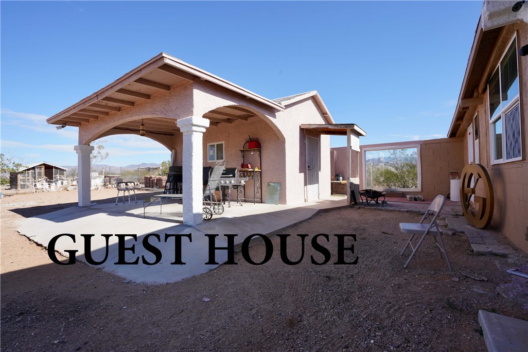 7296 Ligurta Road Golden Valley, AZ 86413 - Photo 5 of 49 a view of a car park in front of house
