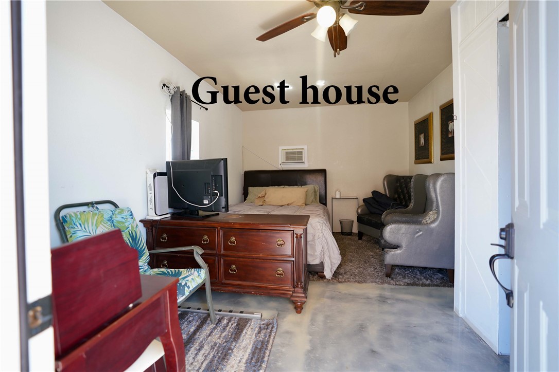 7296 Ligurta Road Golden Valley, AZ 86413 - Photo 6 of 49 a bedroom with furniture and a flat screen tv