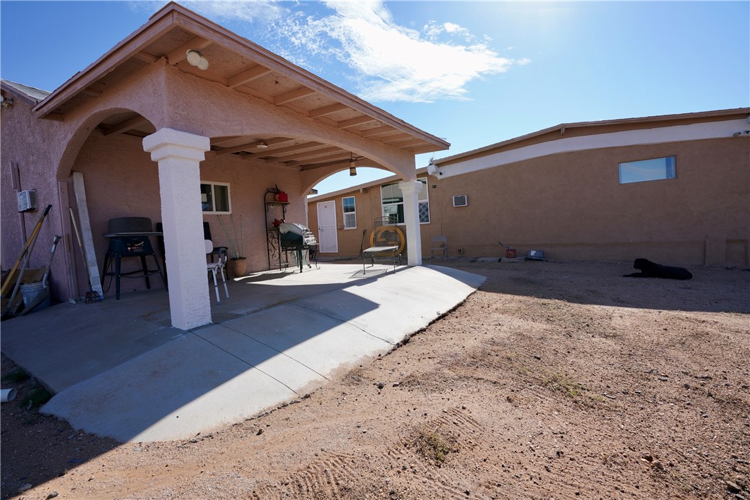 7296 Ligurta Road Golden Valley, AZ 86413 - Photo 7 of 49 a view of a back yard of the house