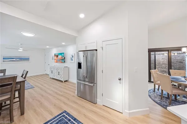a kitchen with stainless steel appliances granite countertop a refrigerator and a stove top oven
