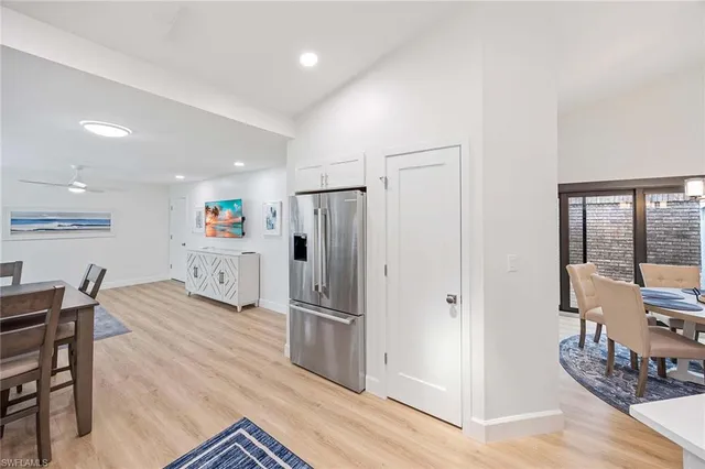 a kitchen with stainless steel appliances granite countertop a refrigerator and a stove top oven