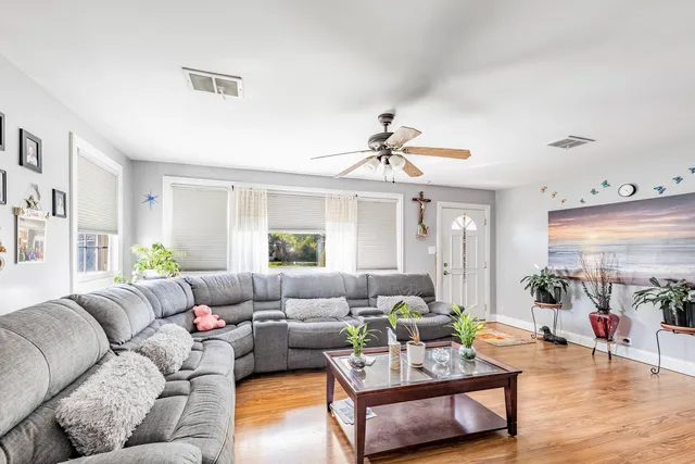 a living room with furniture and a large window