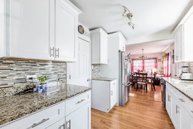 a kitchen with sink and cabinets
