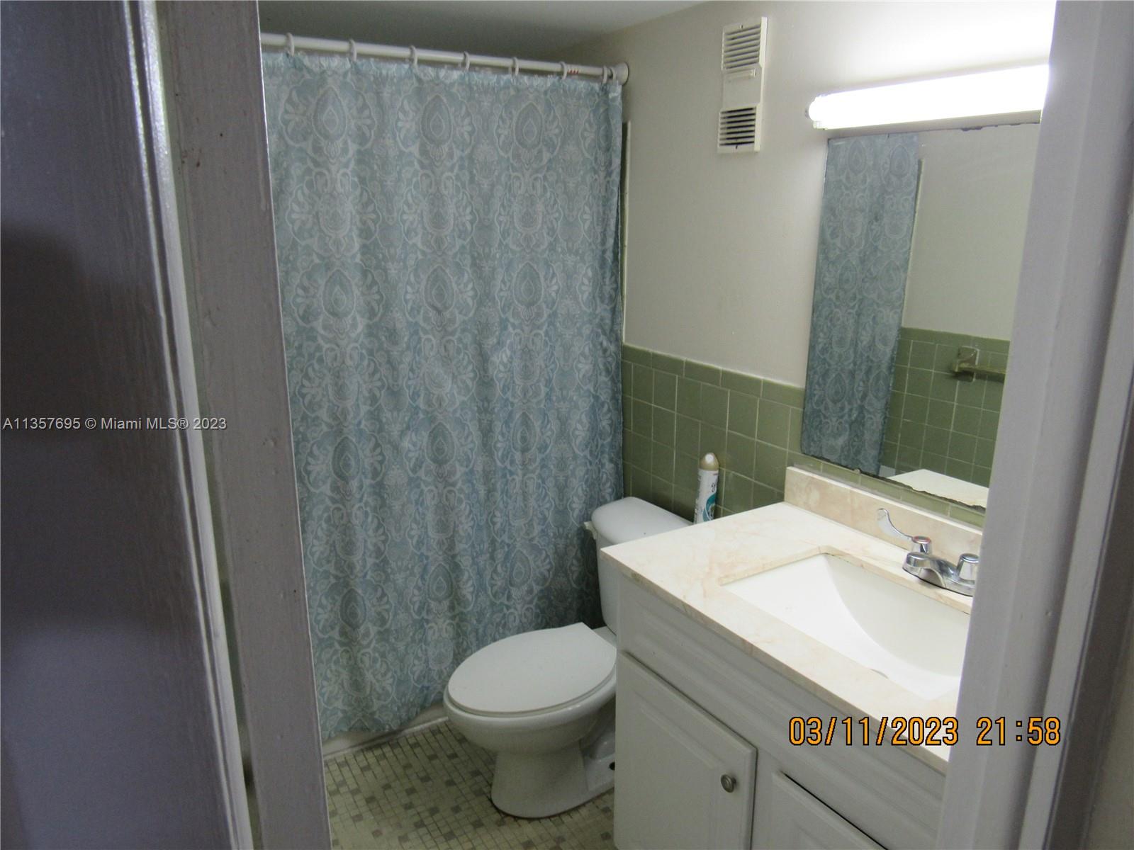 Flagami Miami, FL 33126 - Photo 8 of 12 a bathroom with a sink a toilet and shower