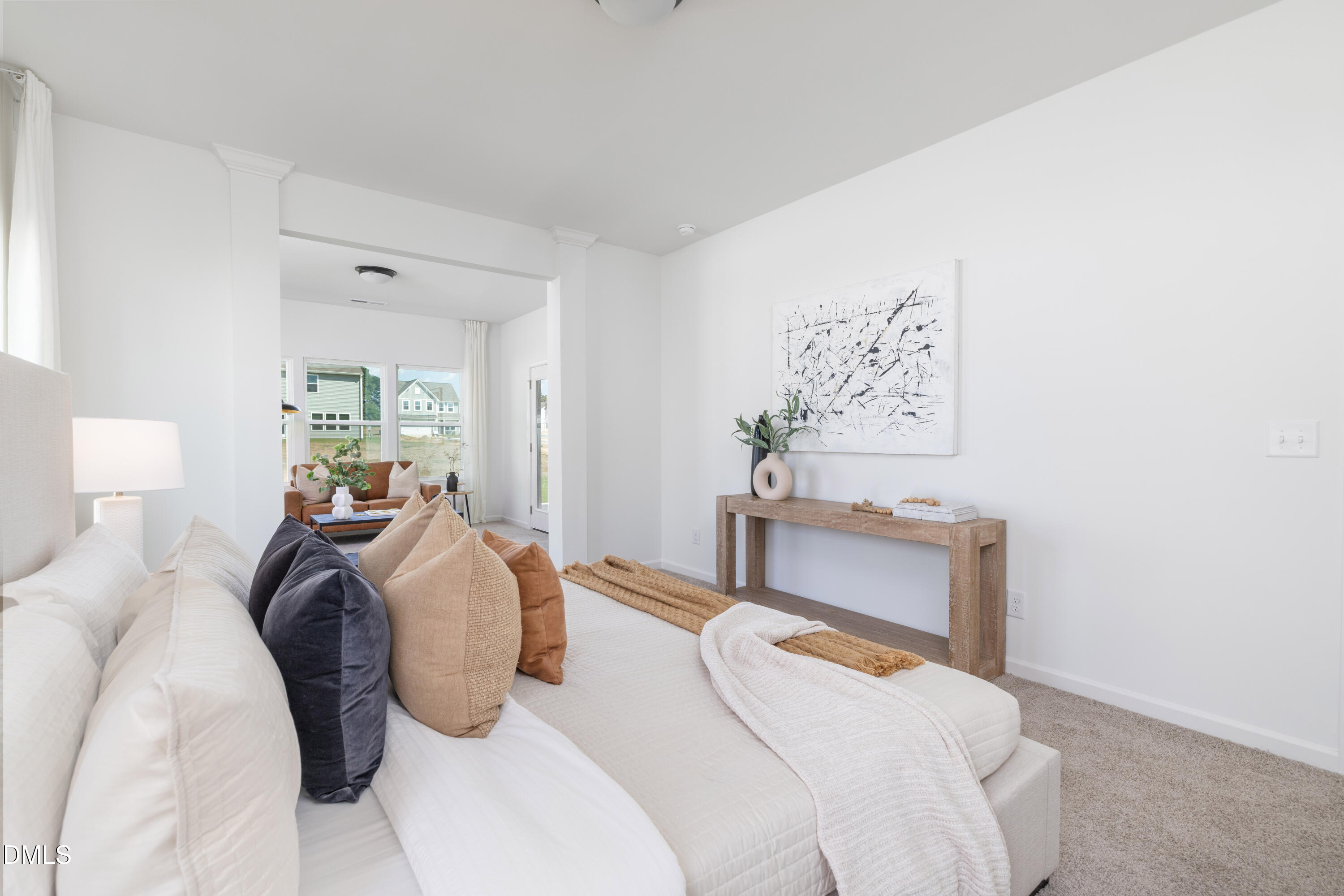 107 South Mule Way, Unit 90 Benson, NC 27504 - Photo 15 of 28 a bedroom with a bed and a chandelier