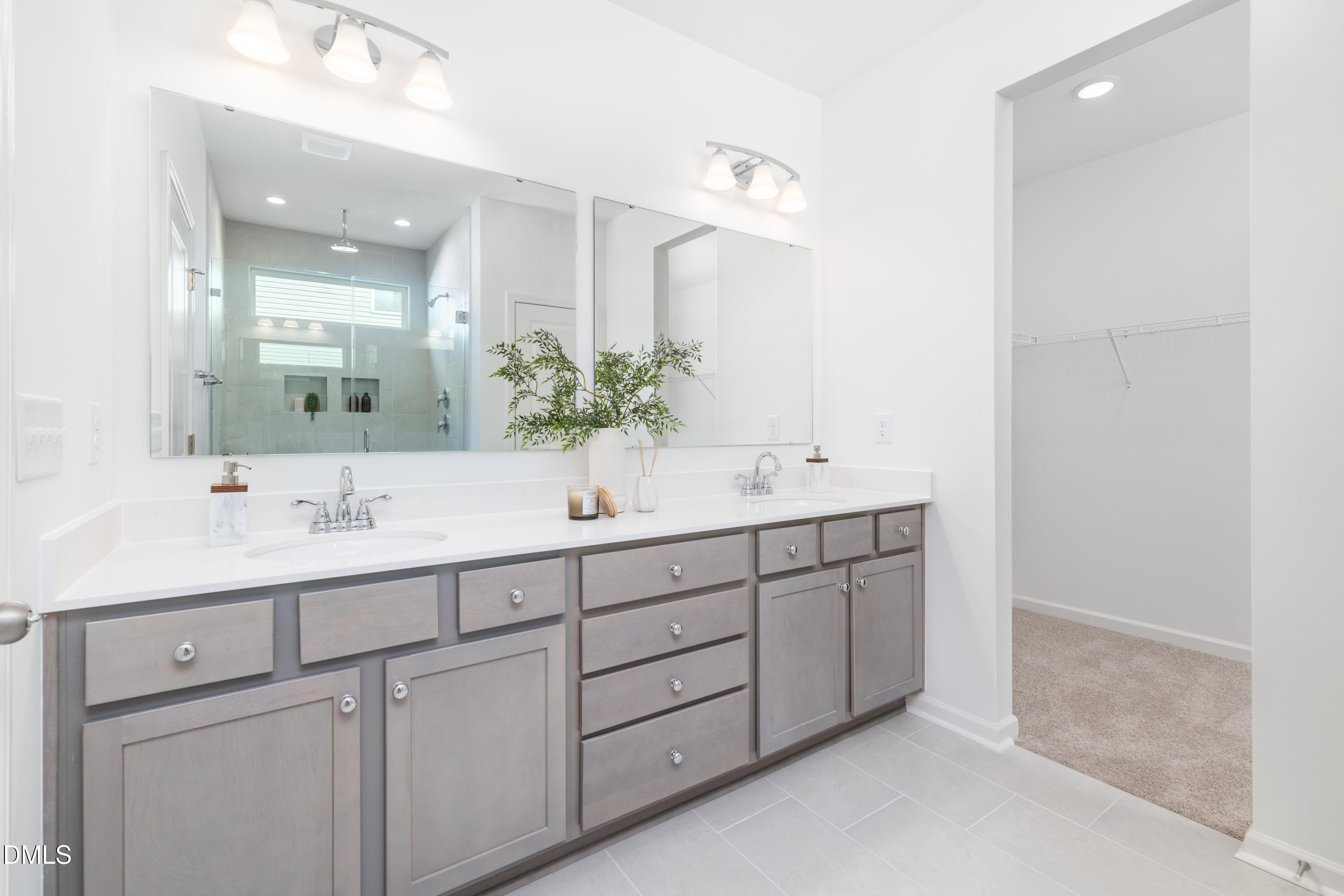 107 South Mule Way, Unit 90 Benson, NC 27504 - Photo 19 of 28 a bathroom with double sink and a mirror