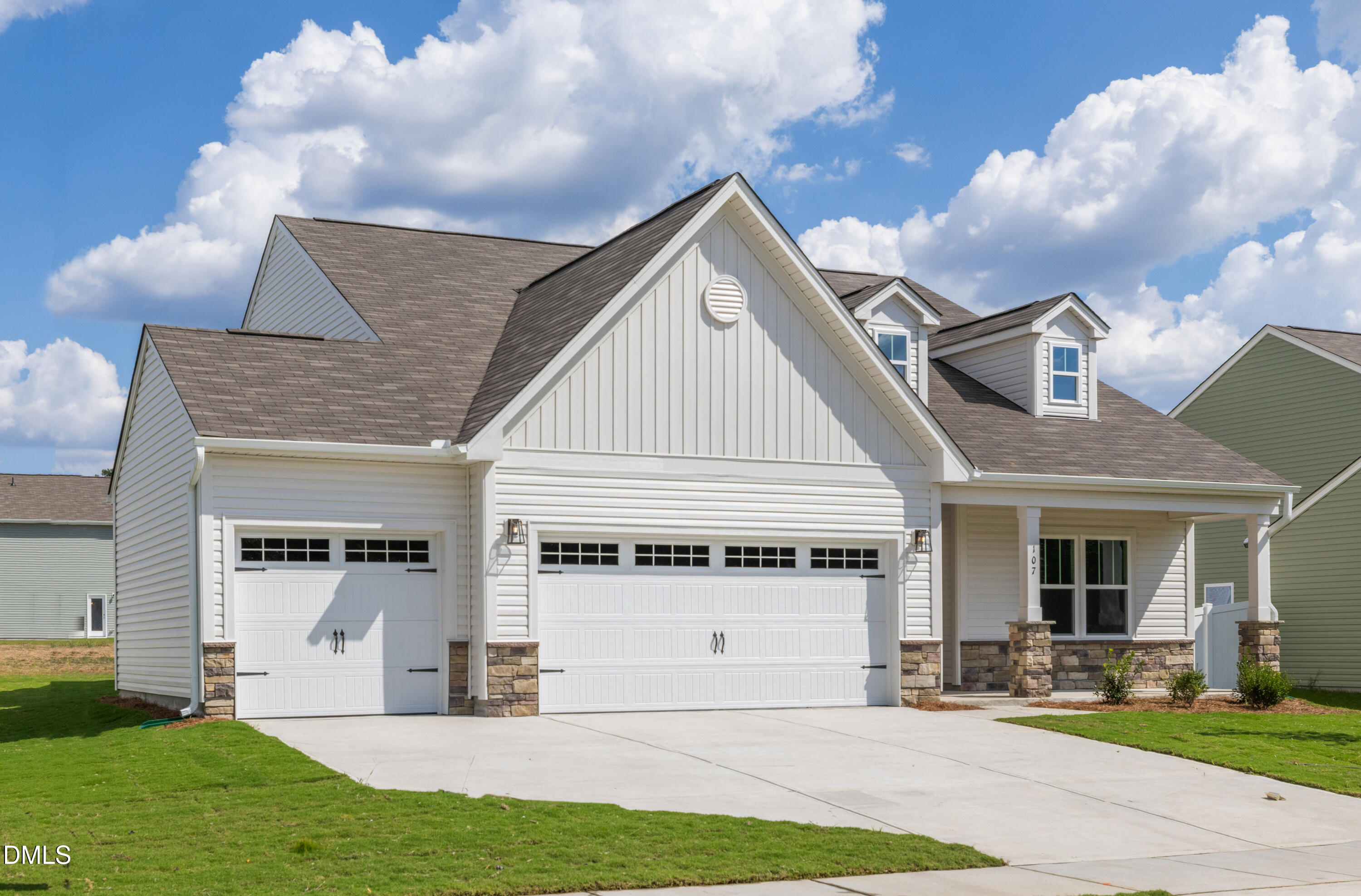 107 South Mule Way, Unit 90 Benson, NC 27504 - Photo 2 of 28 a view of a house with a yard and plants