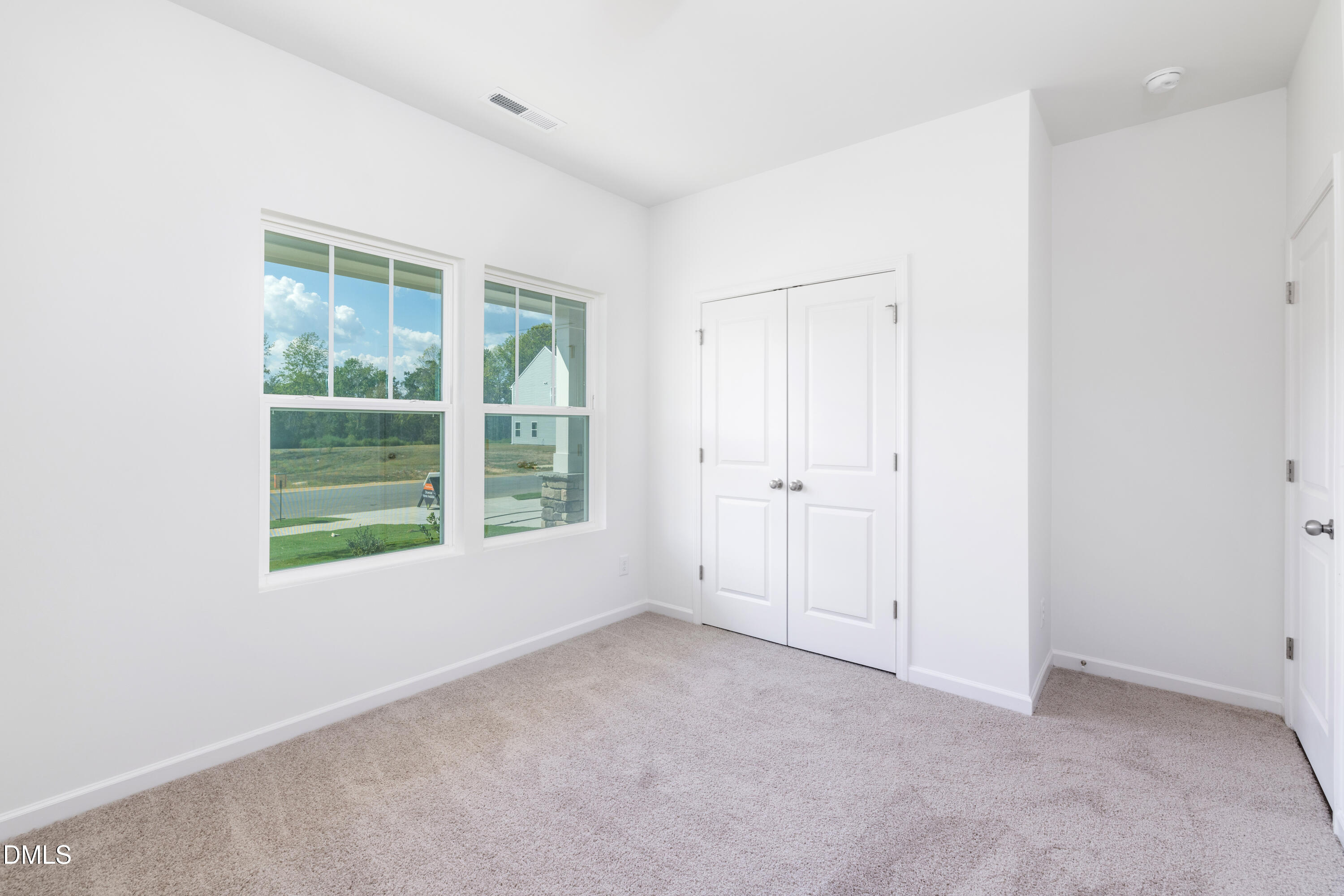 107 South Mule Way, Unit 90 Benson, NC 27504 - Photo 24 of 28 an empty room with a window