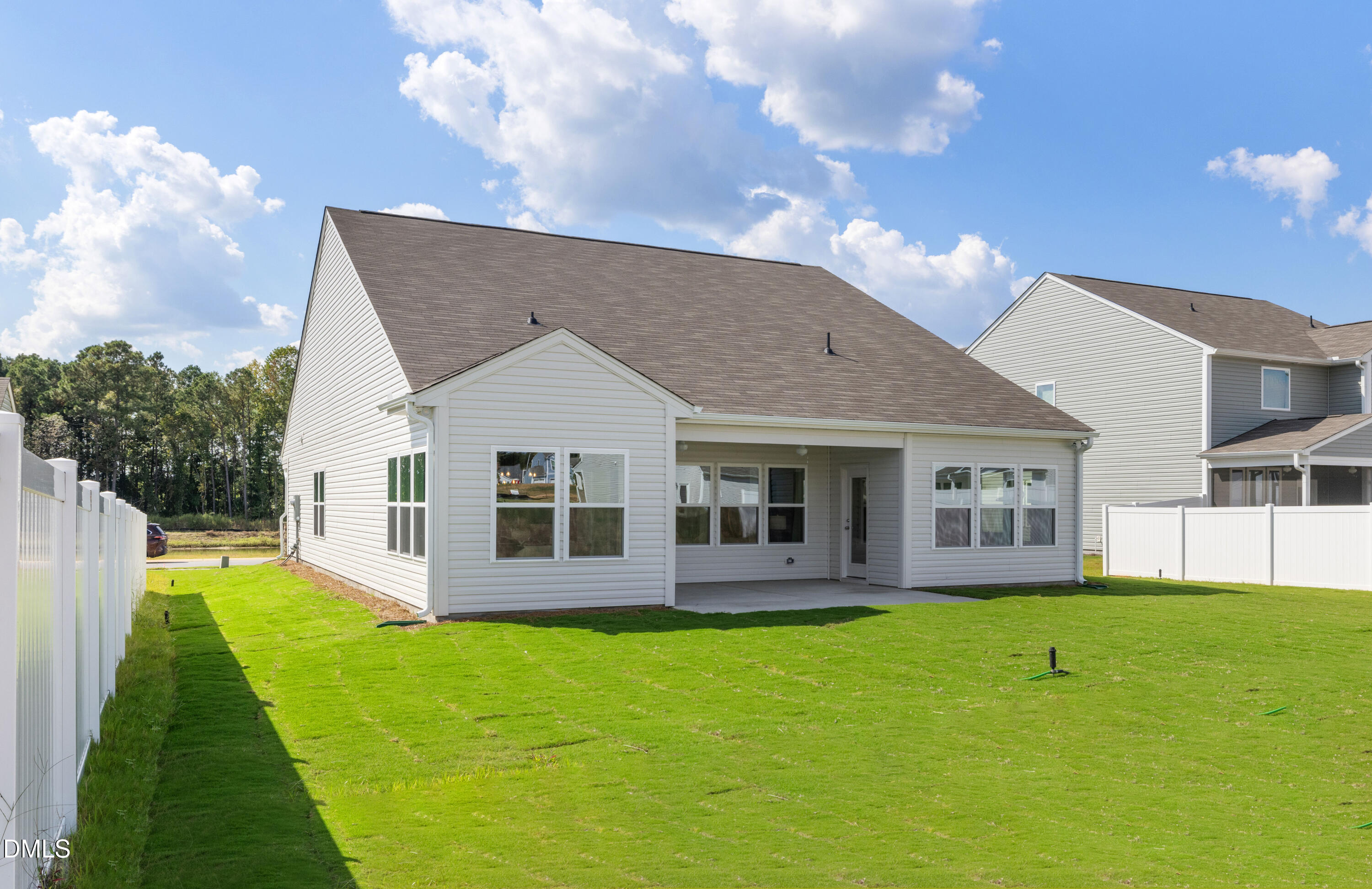 107 South Mule Way, Unit 90 Benson, NC 27504 - Photo 28 of 28 a view of a house with a backyard porch and sitting area