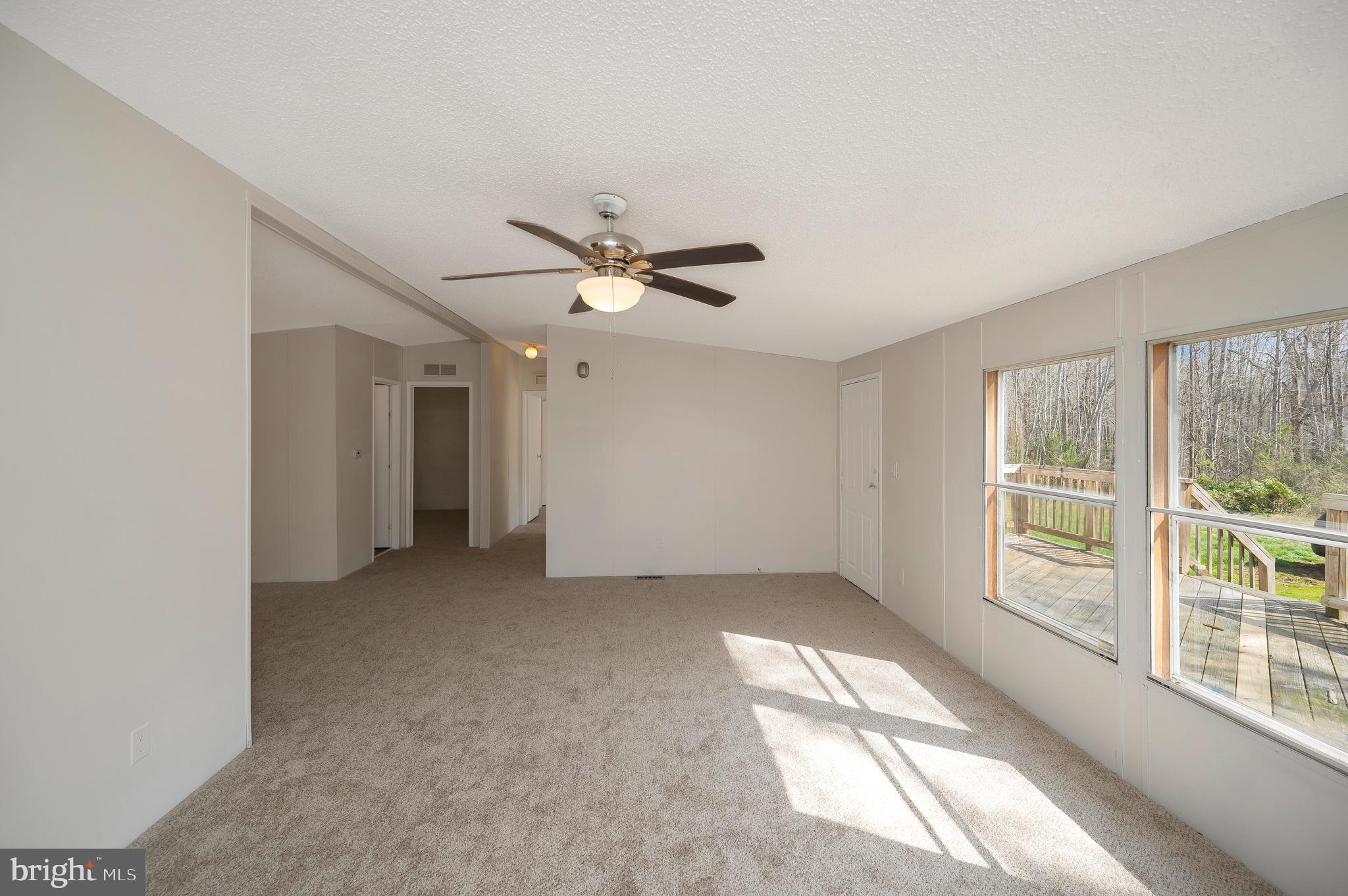 8705 Alsop Town Road Spotsylvania, VA 22551 - Photo 11 of 33 wooden floor in an empty room with a window