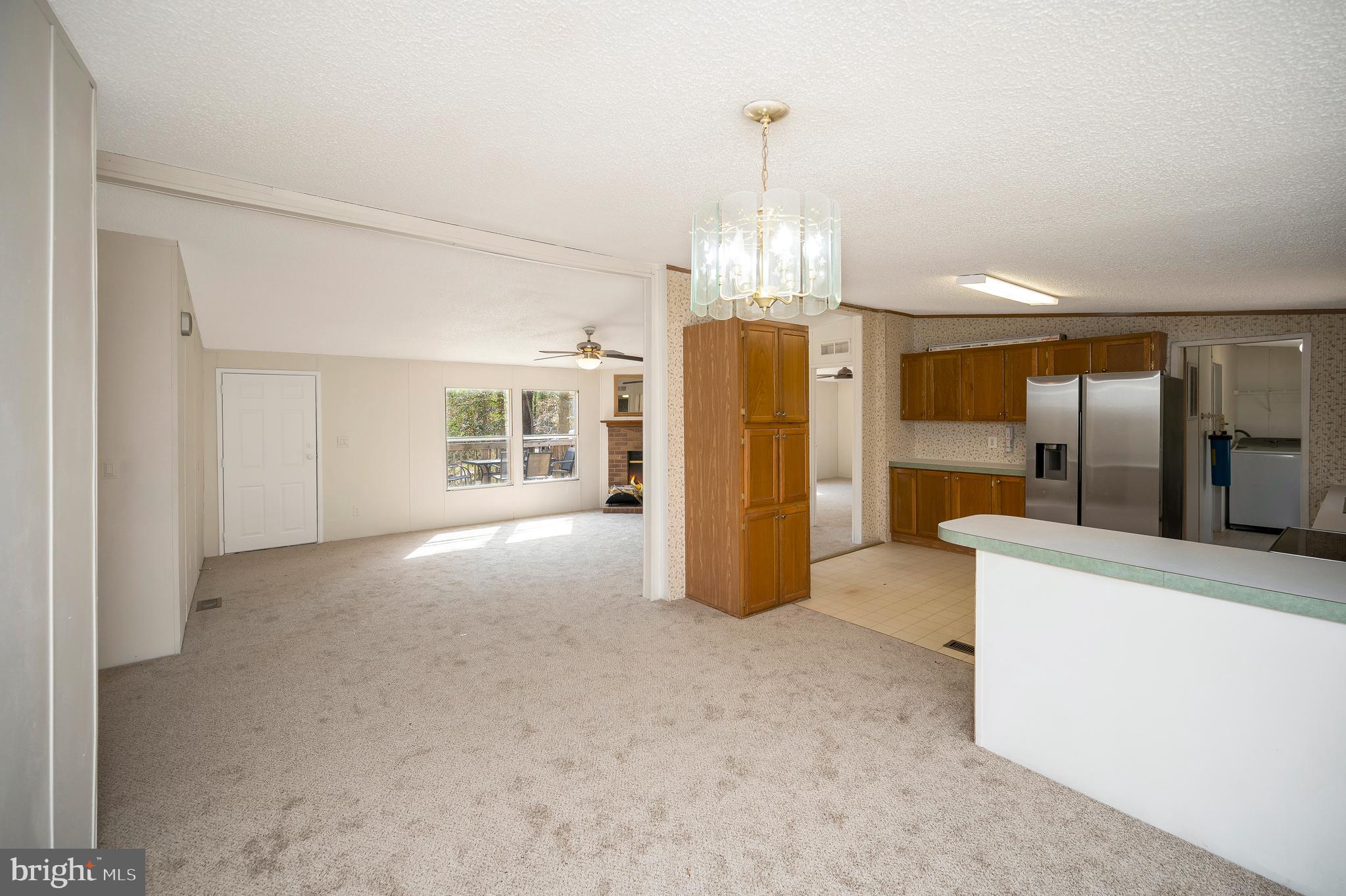 8705 Alsop Town Road Spotsylvania, VA 22551 - Photo 14 of 33 a view of a kitchen with refrigerator and windows