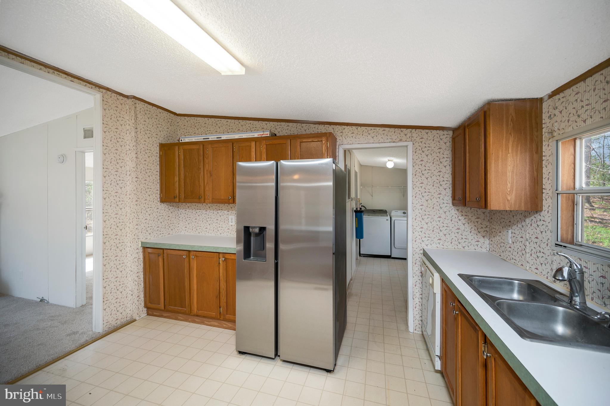 8705 Alsop Town Road Spotsylvania, VA 22551 - Photo 20 of 33 a kitchen with stainless steel appliances granite countertop a refrigerator a sink and a stove