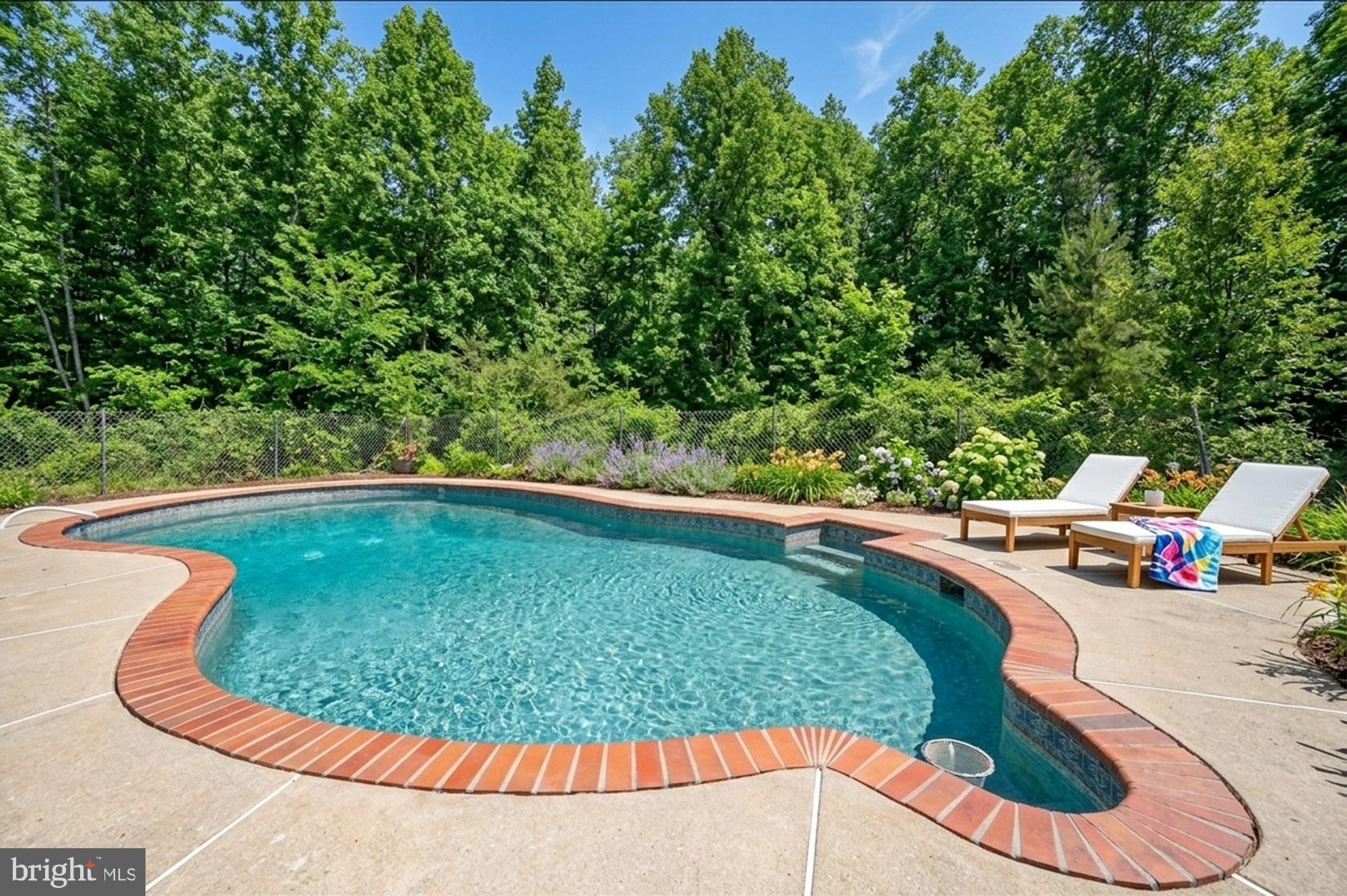 8705 Alsop Town Road Spotsylvania, VA 22551 - Photo 2 of 33 a view of a swimming pool with a sitting area