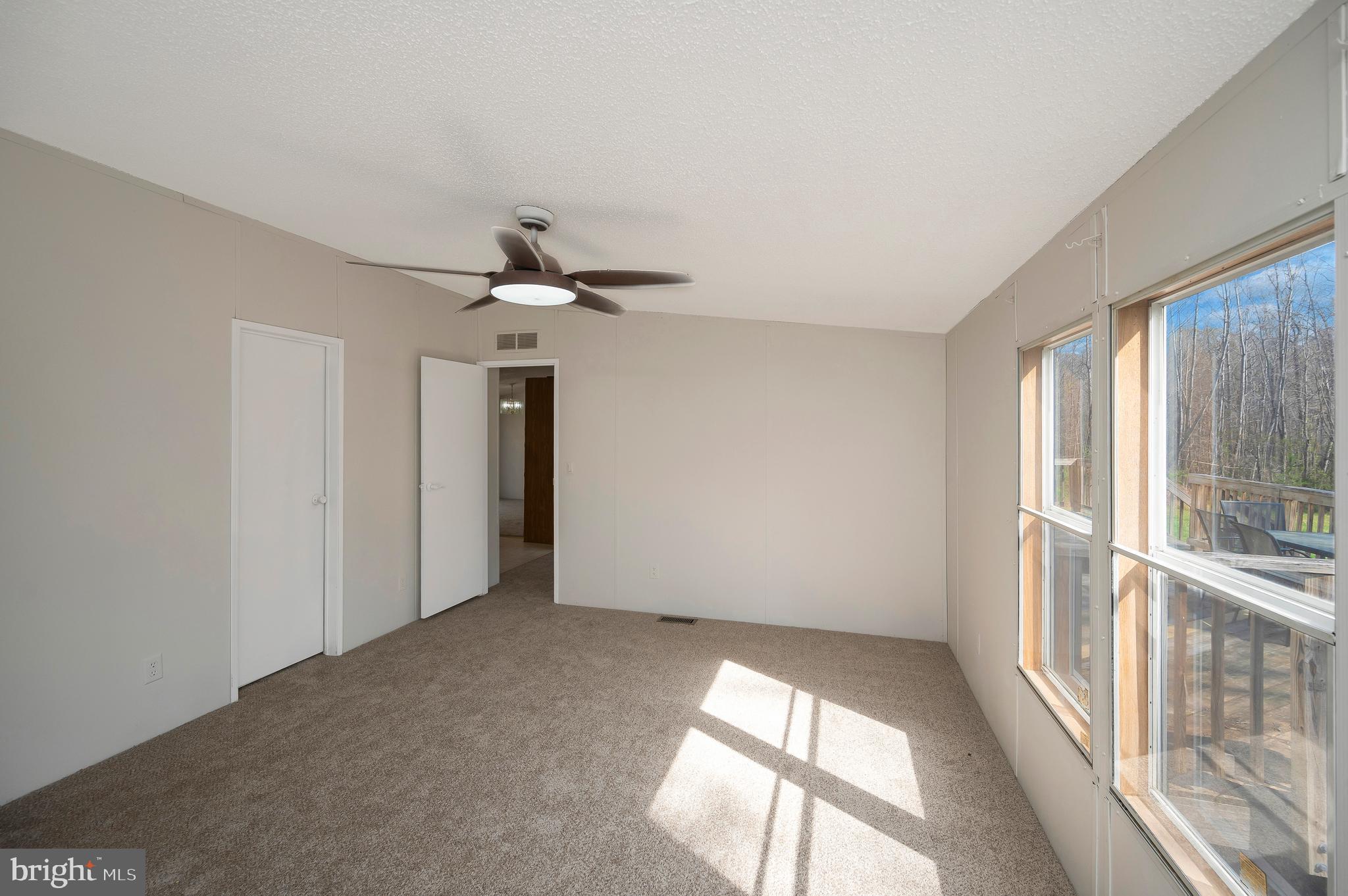 8705 Alsop Town Road Spotsylvania, VA 22551 - Photo 25 of 33 wooden floor in an empty room with a window