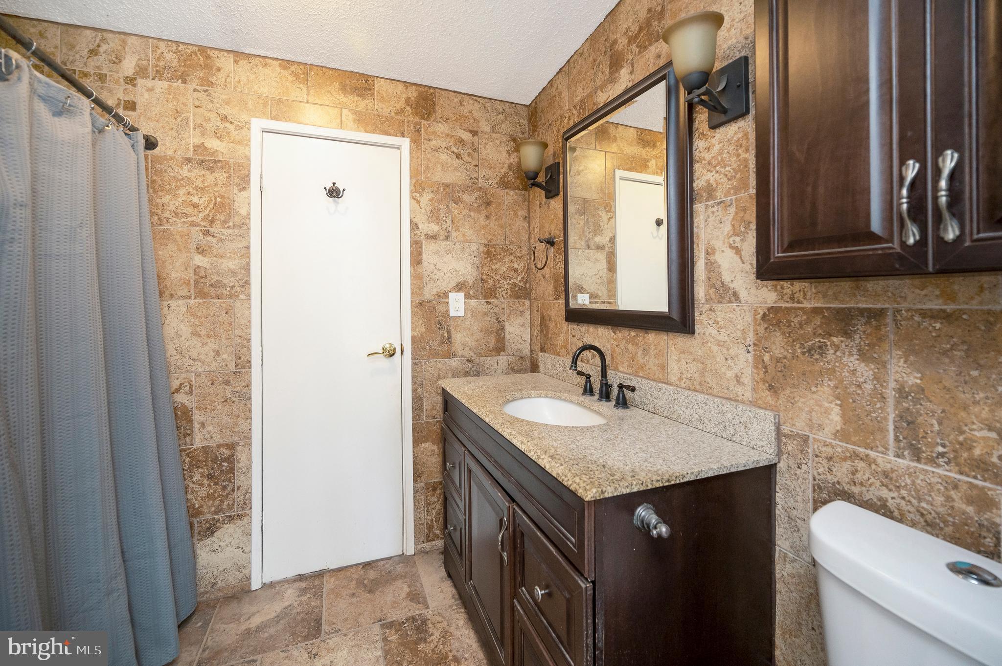 8705 Alsop Town Road Spotsylvania, VA 22551 - Photo 26 of 33 a bathroom with a sink and a mirror