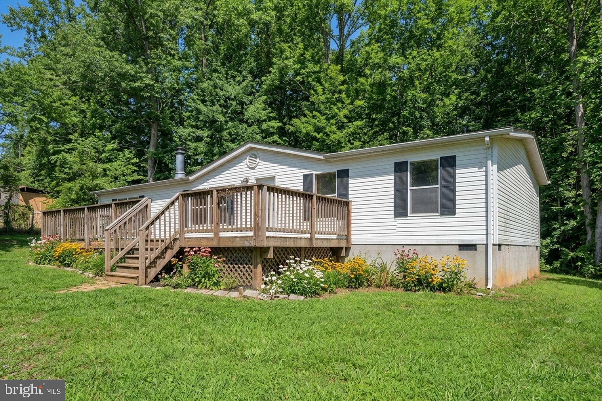 8705 Alsop Town Road Spotsylvania, VA 22551 - Photo 3 of 33 a white house sitting in middle of the grass
