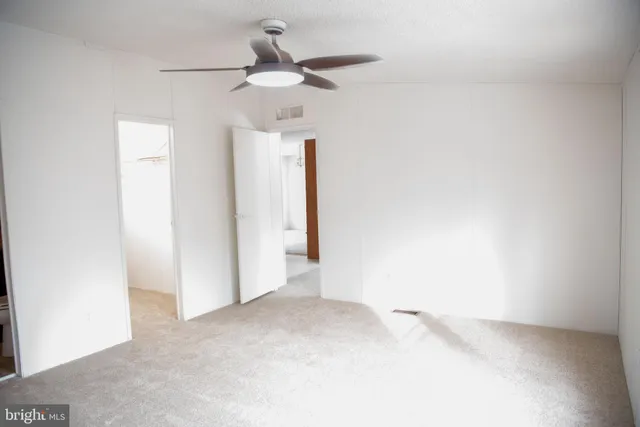 a view of a livingroom with a ceiling fan