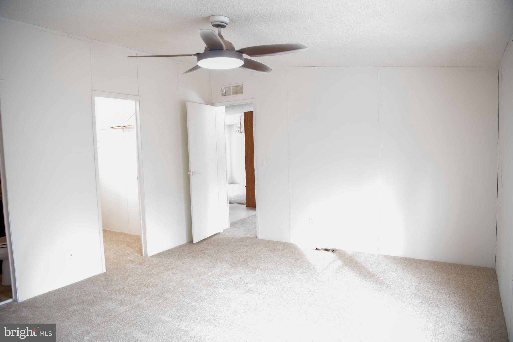8705 Alsop Town Road Spotsylvania, VA 22551 - Photo 3 of 15 a view of a livingroom with a ceiling fan