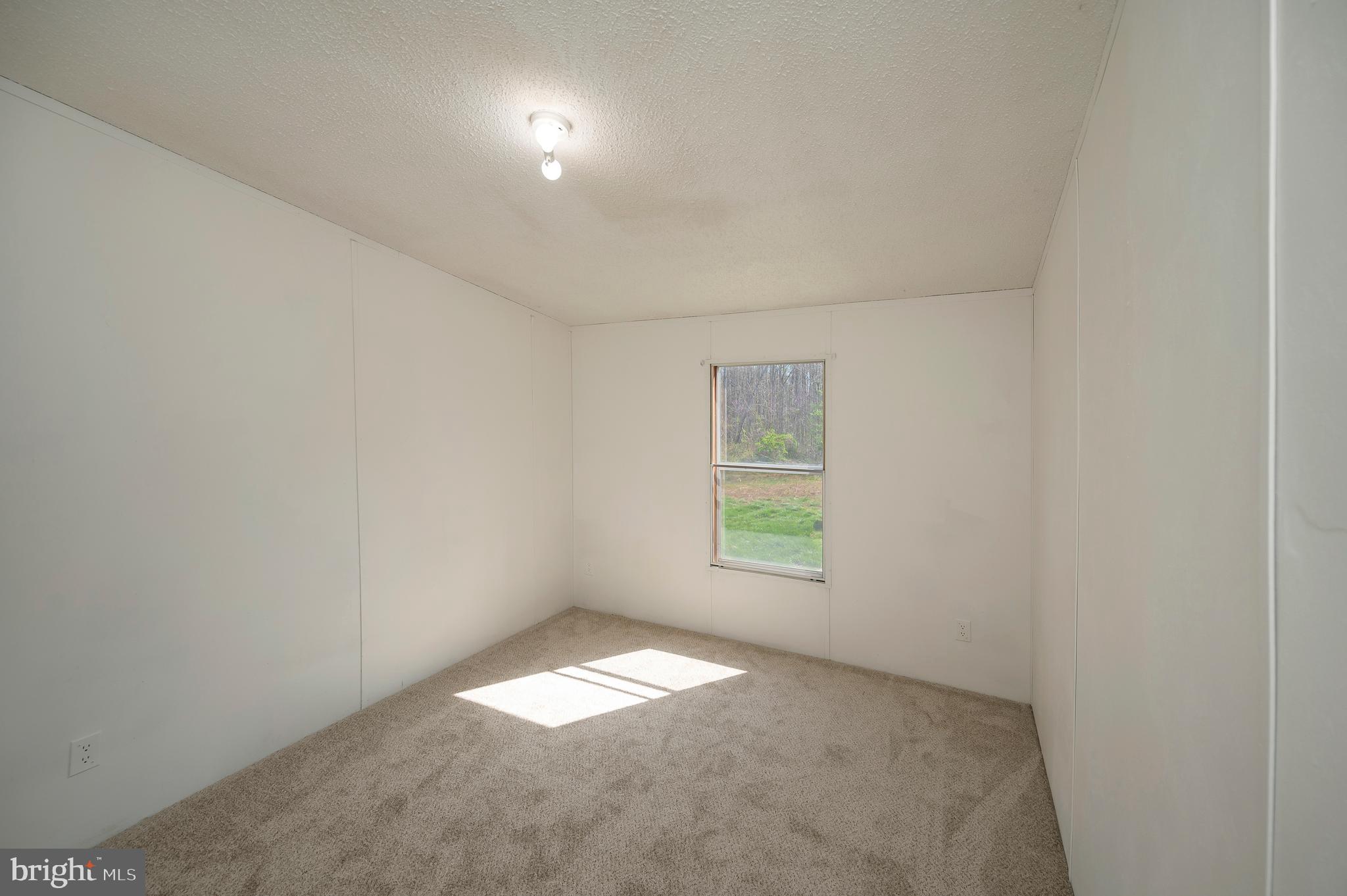 8705 Alsop Town Road Spotsylvania, VA 22551 - Photo 31 of 33 an empty room with a window