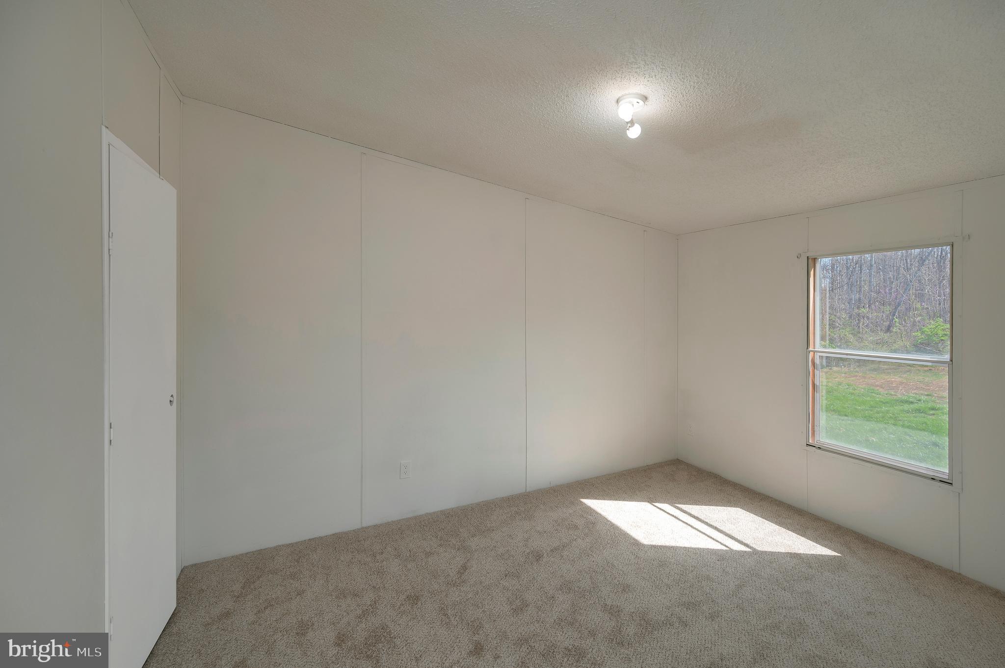 8705 Alsop Town Road Spotsylvania, VA 22551 - Photo 32 of 33 an empty room with a window