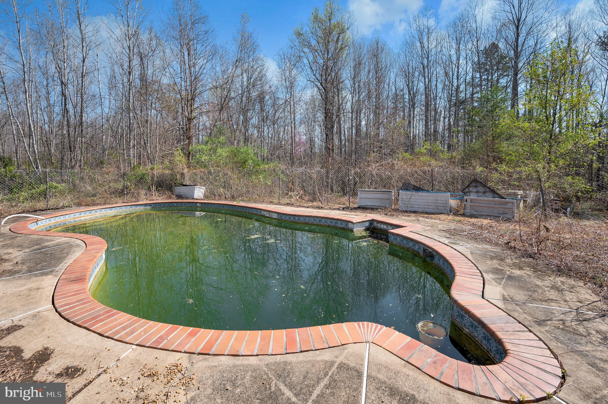 8705 Alsop Town Road Spotsylvania, VA 22551 - Photo 7 of 33 a view of a swimming pool in a yard