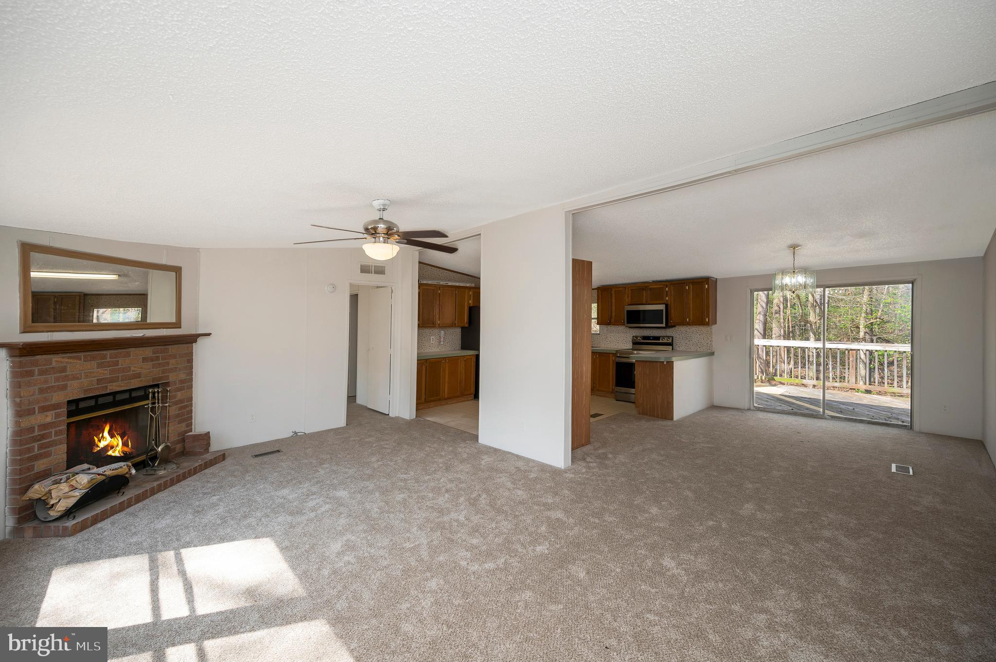 8705 Alsop Town Road Spotsylvania, VA 22551 - Photo 8 of 33 a view of a livingroom with a fireplace and window