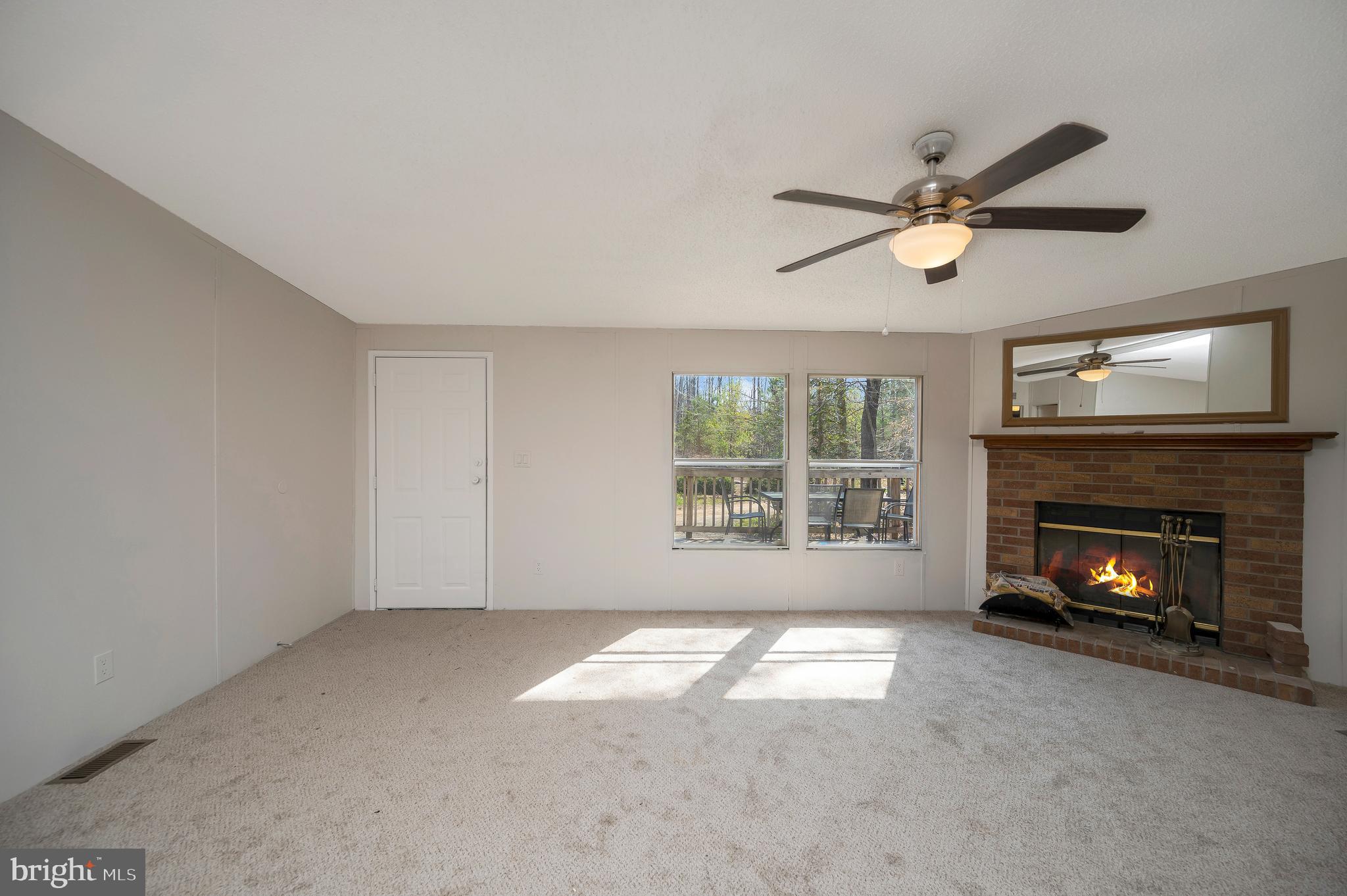 8705 Alsop Town Road Spotsylvania, VA 22551 - Photo 10 of 33 a view of empty room with a fireplace