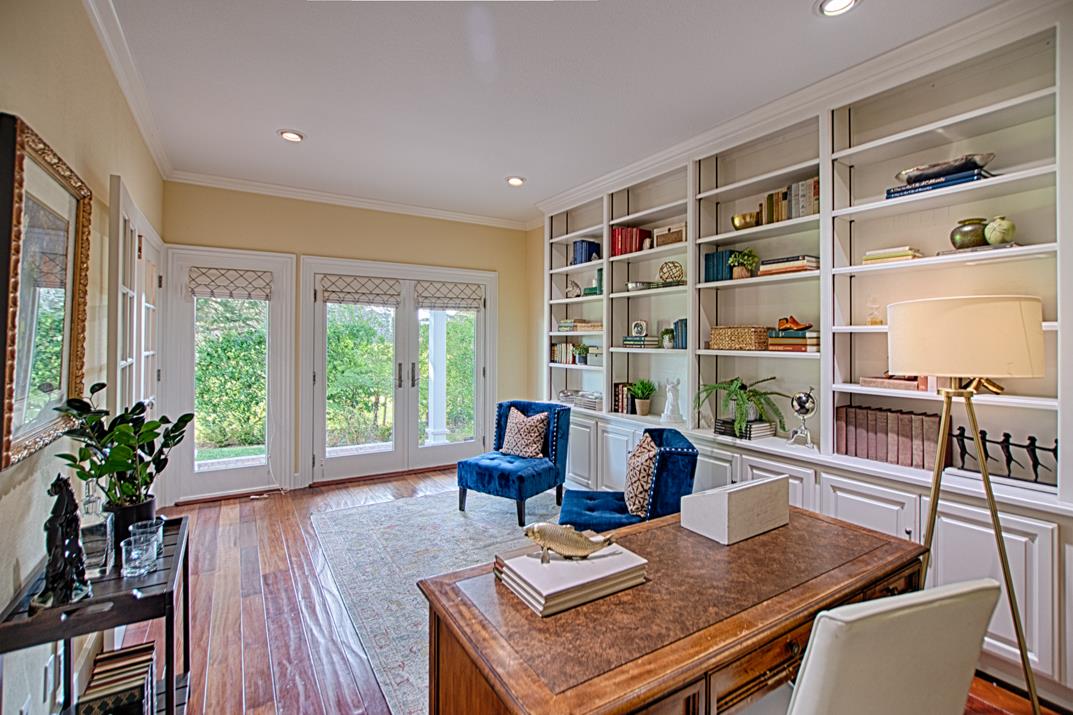 2140 Winged Foot Road Half Moon Bay, CA 94019 - Photo 20 of 52 a living room with furniture a large window and wooden floor