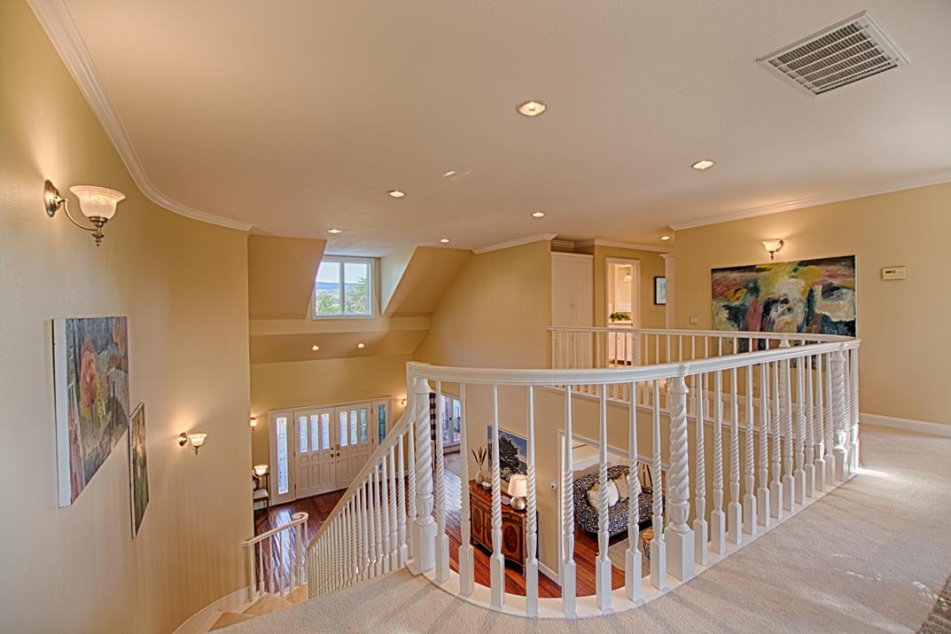 2140 Winged Foot Road Half Moon Bay, CA 94019 - Photo 23 of 52 a view of a hallway with wooden floor and windows